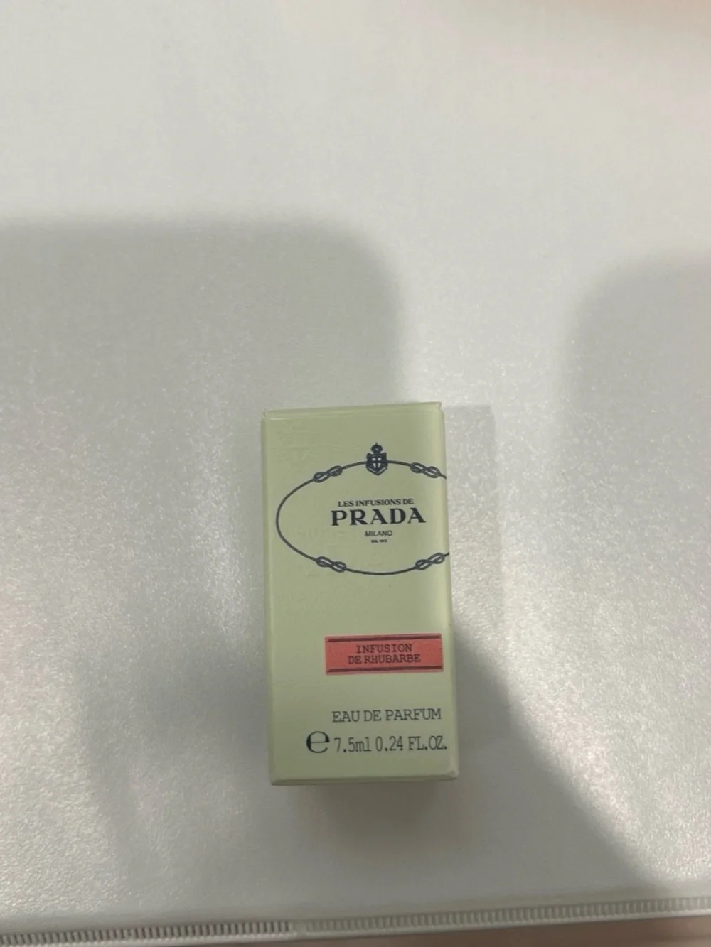 Prada pale mint green box with coral-pink label